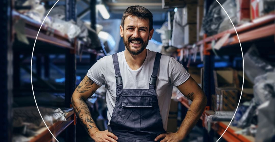 Photo of a man in overalls smiling