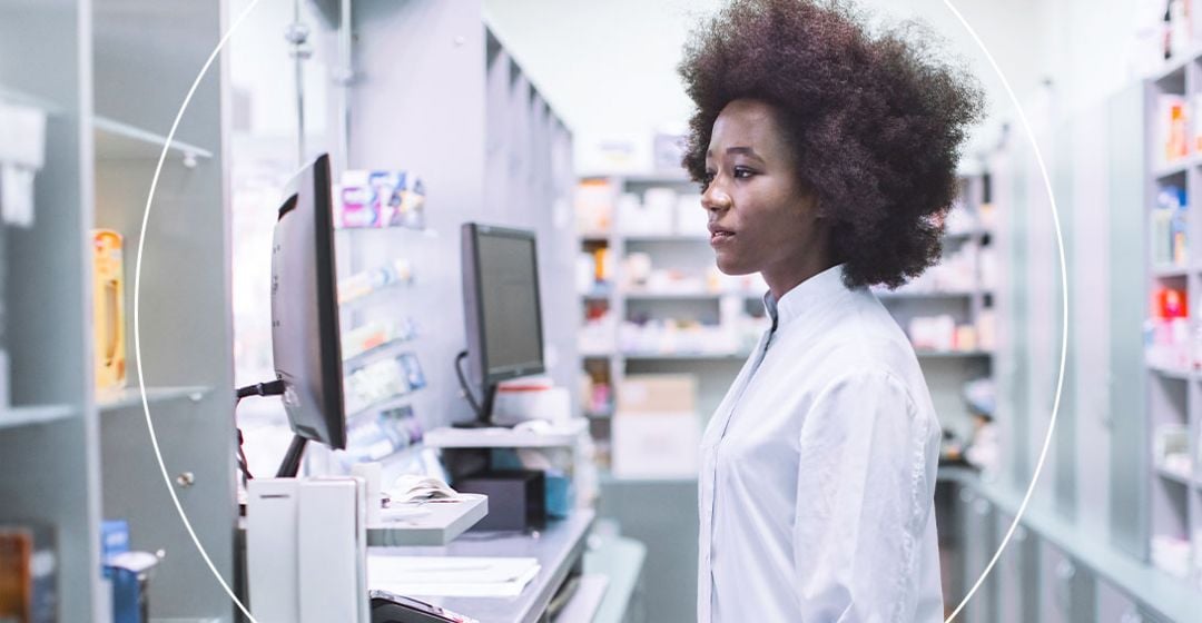 Photo of a lady working looking at a computer screen
